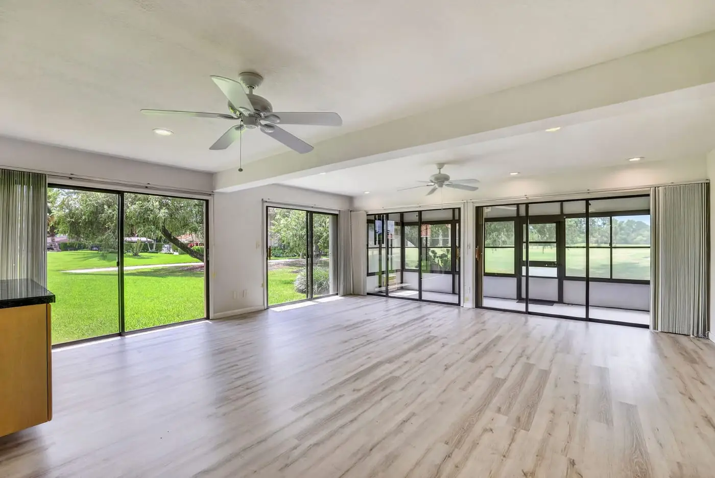 Living room of a South Florida home seen from the kitchen, before virtual staging